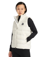 Person wearing a white puffer vest with visible branding on a white background