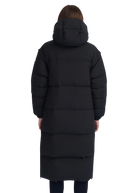 Person wearing a long black puffer coat on a white background