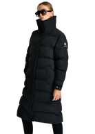 Person wearing a black puffer coat on a white background