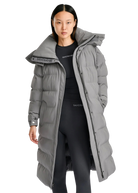Person wearing a long gray puffer coat with a hood on a white background
