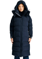Person wearing a long navy blue puffer coat on a white background