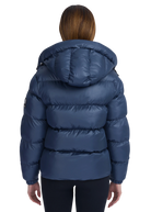 Blue puffer jacket worn by a person on a white background