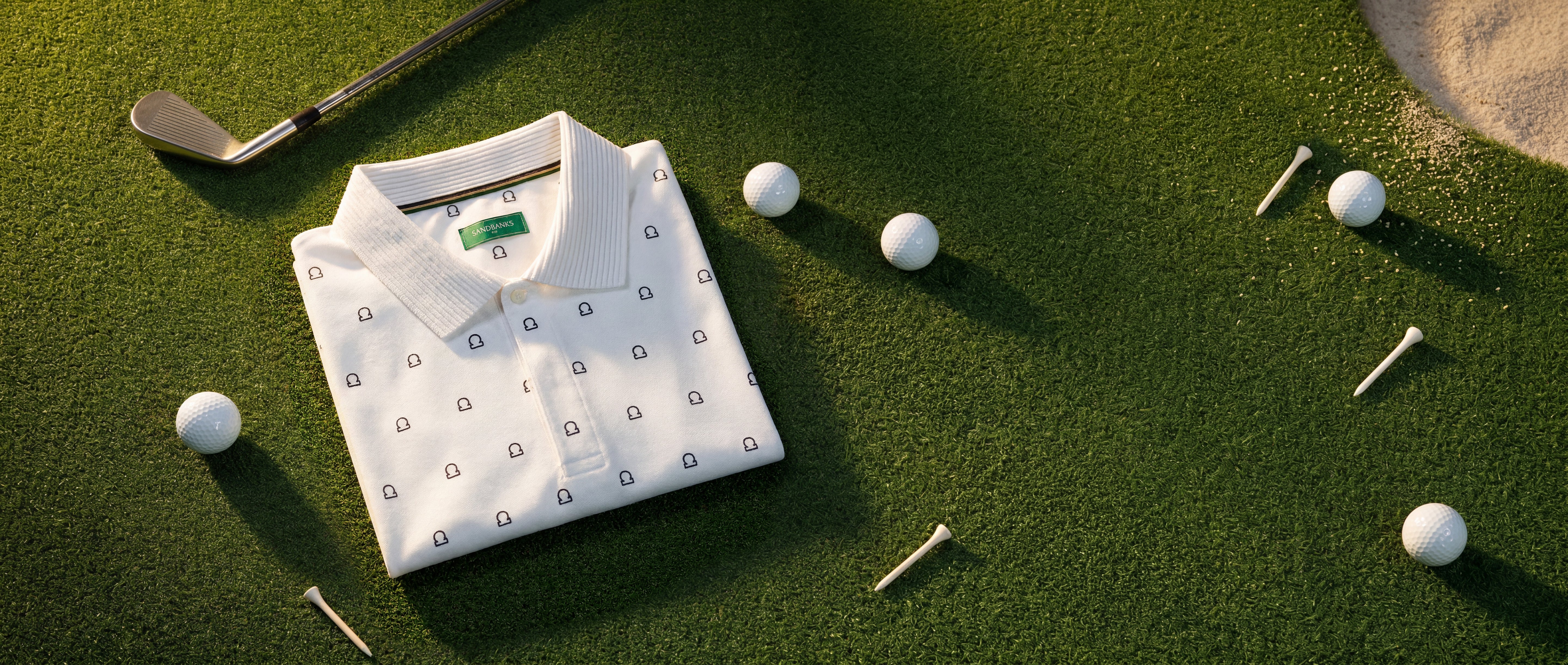 Folded white golf polo shirt