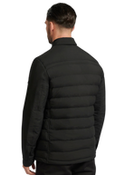 Man wearing a black puffer jacket on a white background