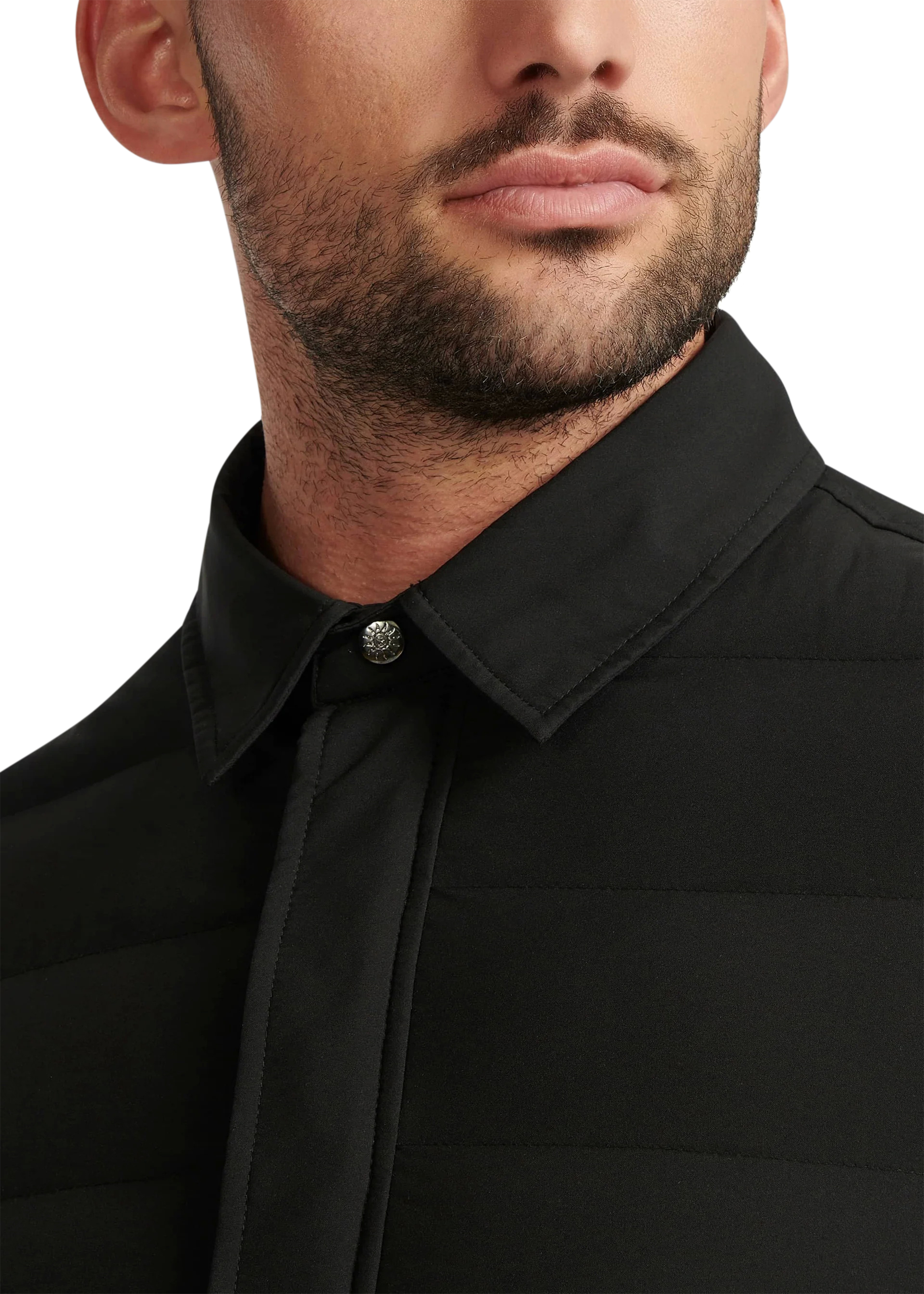 Close-up of a man wearing a black shirt with a tie against a white background