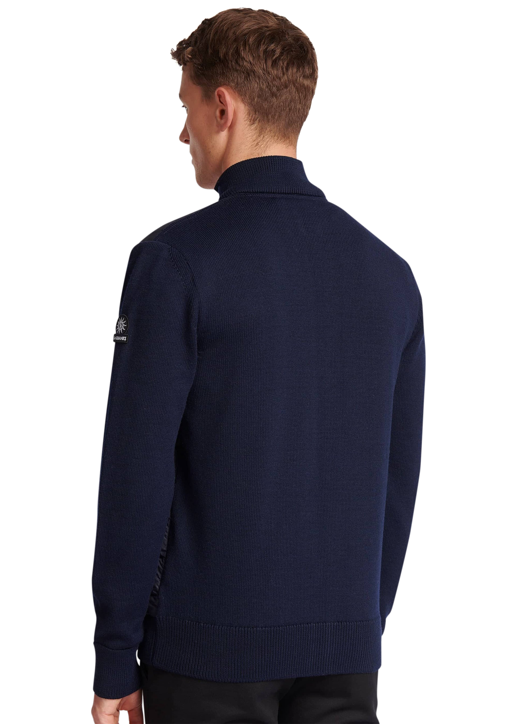 Man wearing a navy blue sweater on a white background