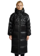 Woman wearing a black quilted coat on a white background
