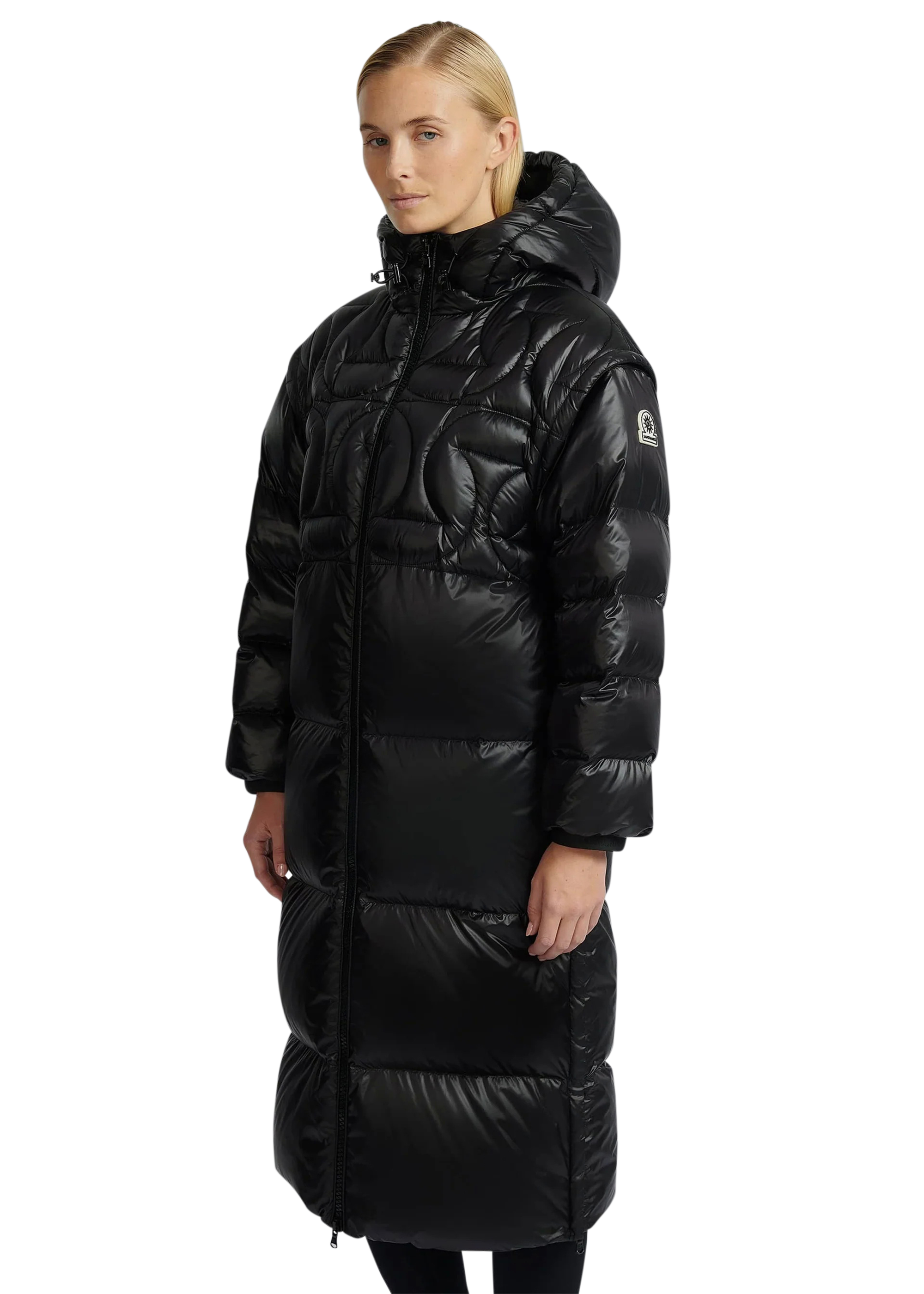 Woman wearing a black puffer coat on a white background