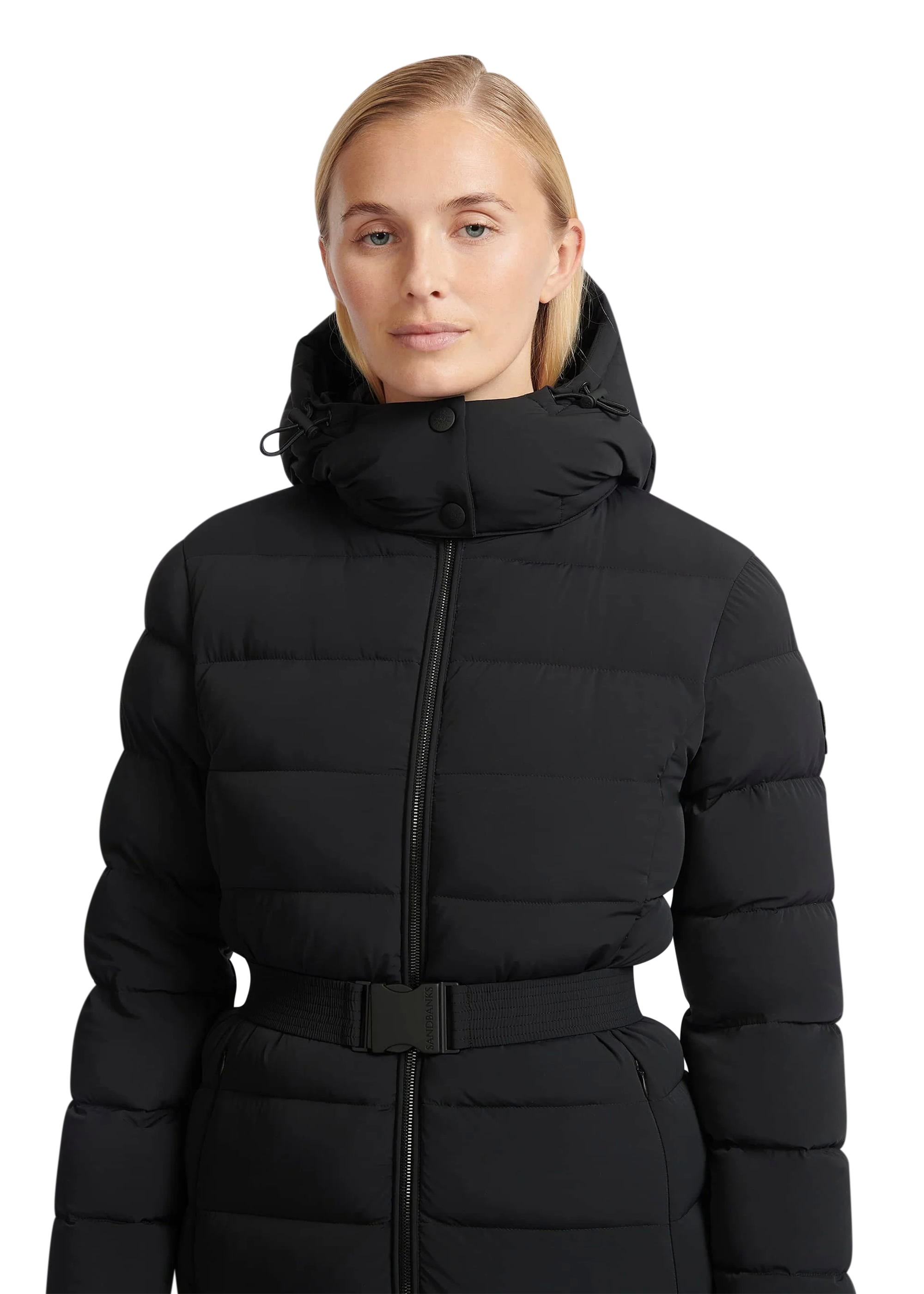 Woman wearing a black puffer jacket on a white background